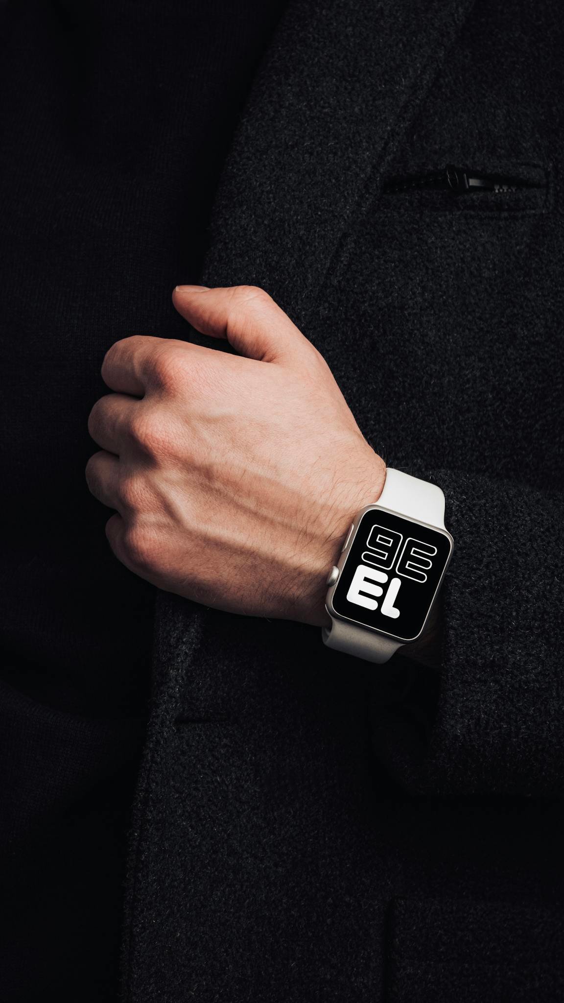 Close-up of a fashionable modern wristwatch on a person's wrist, emphasizing style and elegance.
