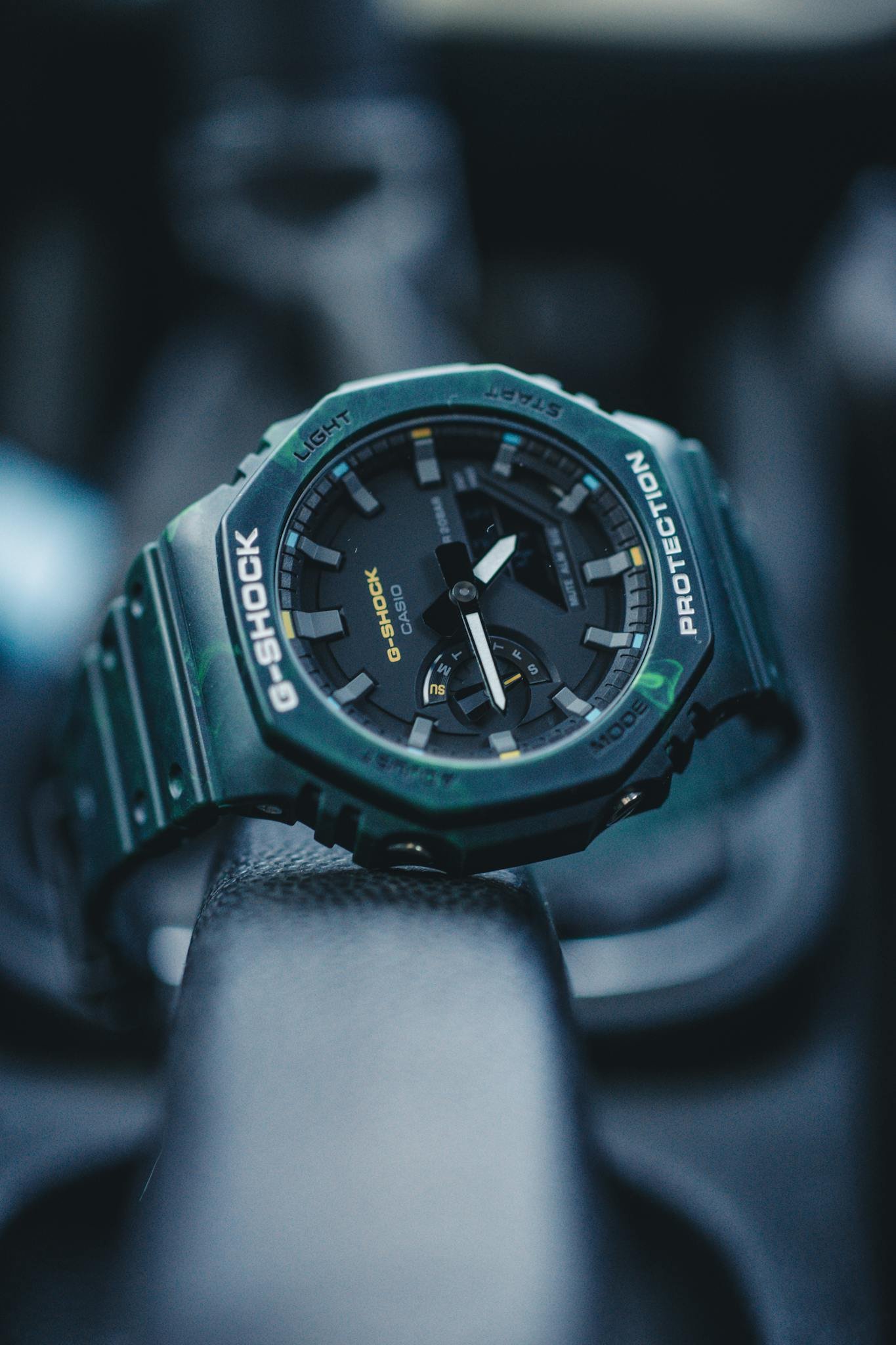 Dark close-up shot of a Casio G-Shock wristwatch showcasing precision and design.