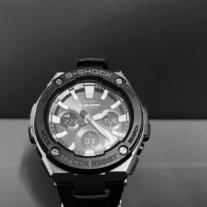 Monochrome close-up of an elegant G-Shock wristwatch showcasing its intricate design.