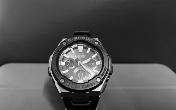 Monochrome close-up of an elegant G-Shock wristwatch showcasing its intricate design.